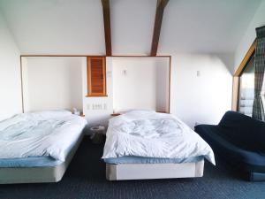 Postelja oz. postelje v sobi nastanitve コテージ自給自足世屋高原