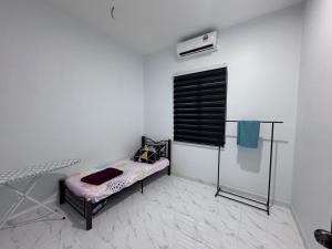 Postel nebo postele na pokoji v ubytování Homestay Tangkak Kasih Zaleha