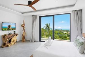 Ένα ή περισσότερα κρεβάτια σε δωμάτιο στο Casa Samui 4 Br Private Pool & Sea View +28 φωτογραφίες