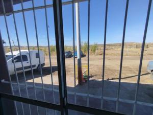 a view of a truck parked in a parking lot at Apart Yo sur in Comodoro Rivadavia