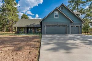 a house with a garage with a driveway at Cozy Studio Space in Williams in Williams