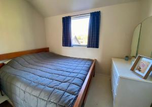 Postel nebo postele na pokoji v ubytování Ngahere Ski Lodge - Methven