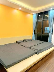 Postel nebo postele na pokoji v ubytování HT homestay ocp3 + 2 fotografie