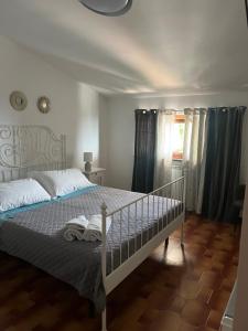 Postel nebo postele na pokoji v ubytování B&B Villa Reginella