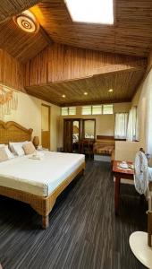 Postel nebo postele na pokoji v ubytování Tahanan Resort