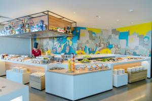 a restaurant with a buffet of food on display at CENTRAL PLAZA HOTEL - Mỹ Tho in My Tho