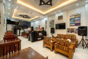a store with a dining room with tables and chairs at Golden Bell Homestay in Hoi An