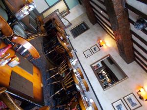 an overhead view of a restaurant with tables and chairs at The White Lion Hotel in Machynlleth