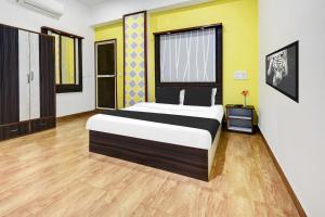 Postel nebo postele na pokoji v ubytování Super Hotel O Porvorim Near Mall De Goa
