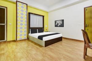 Postel nebo postele na pokoji v ubytování Super Hotel O Porvorim Near Mall De Goa