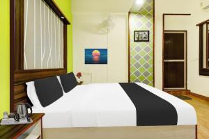 Postel nebo postele na pokoji v ubytování Super Hotel O Porvorim Near Mall De Goa