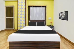 Postel nebo postele na pokoji v ubytování Super Hotel O Porvorim Near Mall De Goa