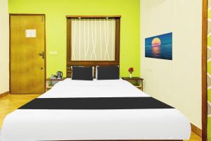Postel nebo postele na pokoji v ubytování Super Hotel O Porvorim Near Mall De Goa