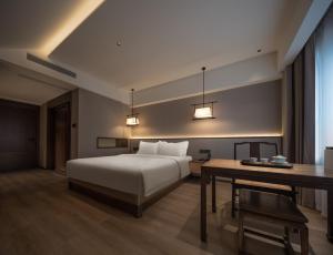 Krevet ili kreveti u jedinici u okviru objekta Chengdu Jianshantang Hotel Kuanzhai Alley Branch