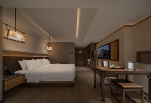 Krevet ili kreveti u jedinici u okviru objekta Chengdu Jianshantang Hotel Kuanzhai Alley Branch