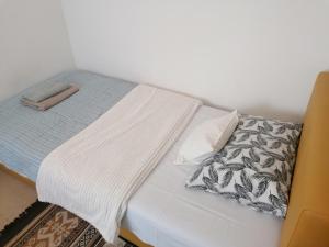 Postel nebo postele na pokoji v ubytování Apartman Centar 2
