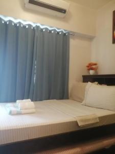 Postel nebo postele na pokoji v ubytování Guest Best Suite at Grass Residences