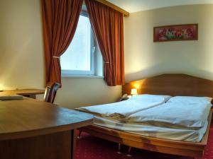 מיטה או מיטות בחדר ב-Hotel West