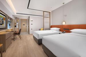 Voodi või voodid majutusasutuse Home2 Suite by Hilton Chaozhou toas