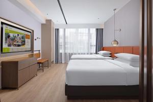 Voodi või voodid majutusasutuse Home2 Suite by Hilton Chaozhou toas
