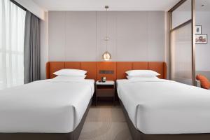 Voodi või voodid majutusasutuse Home2 Suite by Hilton Chaozhou toas