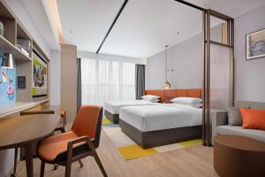 Voodi või voodid majutusasutuse Home2 Suite by Hilton Chaozhou toas