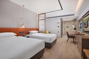 Voodi või voodid majutusasutuse Home2 Suite by Hilton Chaozhou toas