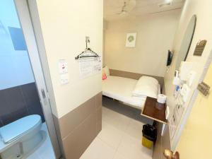 Kopalnica v nastanitvi Apple Hostel 蘋果賓館