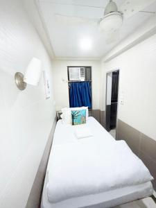 Postelja oz. postelje v sobi nastanitve Apple Hostel 蘋果賓館