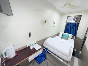 Postelja oz. postelje v sobi nastanitve Apple Hostel 蘋果賓館