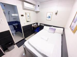 Postelja oz. postelje v sobi nastanitve Apple Hostel 蘋果賓館