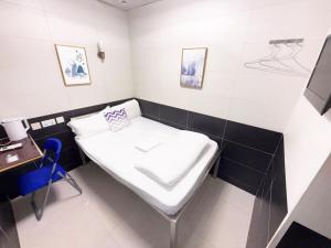 Postelja oz. postelje v sobi nastanitve Apple Hostel 蘋果賓館