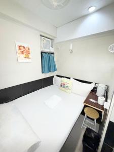 Postelja oz. postelje v sobi nastanitve Apple Hostel 蘋果賓館