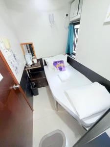 Postelja oz. postelje v sobi nastanitve Apple Hostel 蘋果賓館