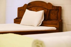 Postel nebo postele na pokoji v ubytování Lucky Hội an Hotel