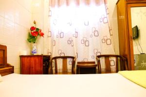Postel nebo postele na pokoji v ubytování Lucky Hội an Hotel