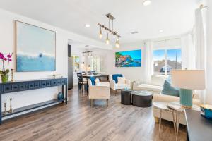 a living room with a couch and a table at Maison on the Beach in Los Angeles