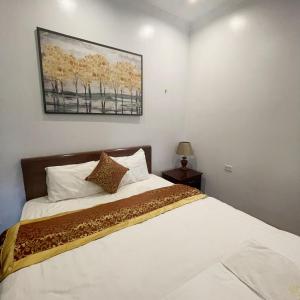 Postel nebo postele na pokoji v ubytování Huong Giang A30