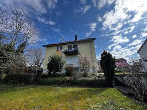 a house with a fence in front of it at Ferienwohnung im Heiligenberg in Langenburg