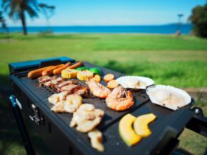 a grill with shrimp and other foods on it at Japari Tateyama - Vacation STAY 75921v in Tateyama +70 photos
