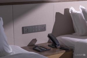 Krevet ili kreveti u jedinici u okviru objekta Chengdu Jianshantang Hotel Kuanzhai Alley Branch