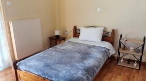 Ένα ή περισσότερα κρεβάτια σε δωμάτιο στο Denis house