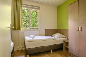 Postel nebo postele na pokoji v ubytování Summio Parc Heihaas