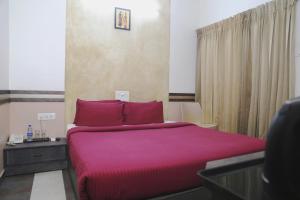 Posteľ alebo postele v izbe v ubytovaní Hotel Sapthagiri Nest