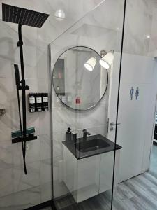 a bathroom with a sink and a mirror at Beach & House''Villa Maria'' 5 min to Mareta Beach in Sagres