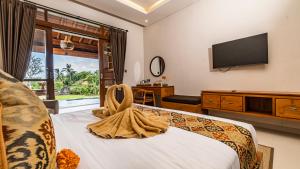 Televisyen dan/atau pusat hiburan di Sabuh Mas Villa Ubud by Aswanaya