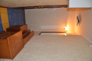 an empty room with a room with a couch and a table at Apartment on Ingenernaya 17 in Mykolaiv