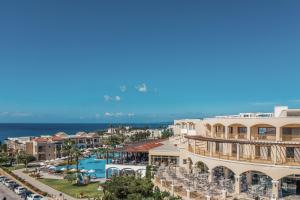 a view of the resort with the ocean in the background at Lindos Imperial Resort & Spa in Kiotari