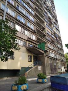 a building with a green door on the side of it at Kiev Central Apartment in Kyiv