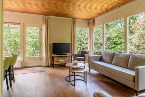 TV a/nebo společenská místnost v ubytování Summio Parc Heihaas